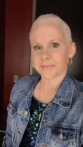 Photo of Caitlin after 6 months of chemo, with short hair